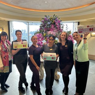Old Course Hotel, Golf Resort and Spa staff holding Hey Girls products in hotel lobby