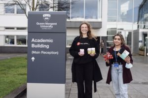 Daisy from hey girls holding products hey girls with a Queen Margaret University (QMU) Edinburgh background