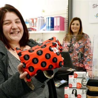 Inverness College students with Hey Girls Products in their student shop